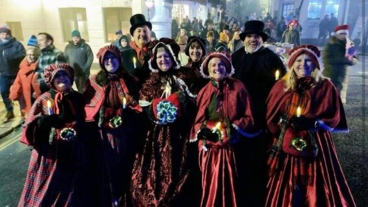 Festive performers in traditional costume at a Christmas event in Battle