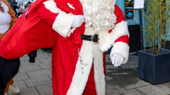 Father Christmas taking part in a festive event in Battle, East Sussex