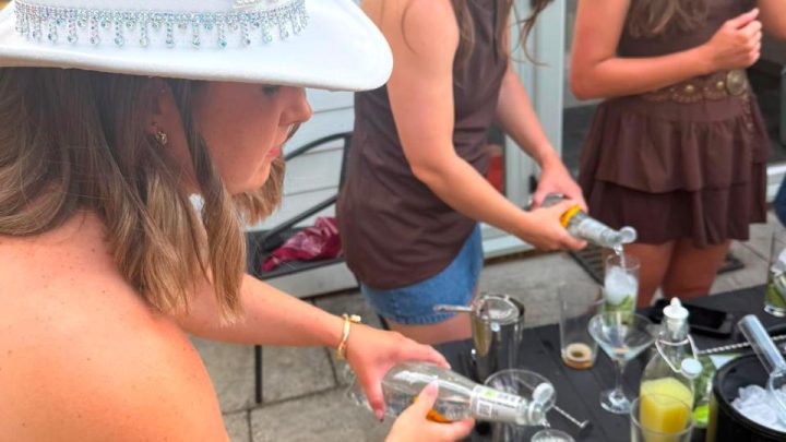 Guests making cocktails together during a group stay at Blackfirs Farmhouse
