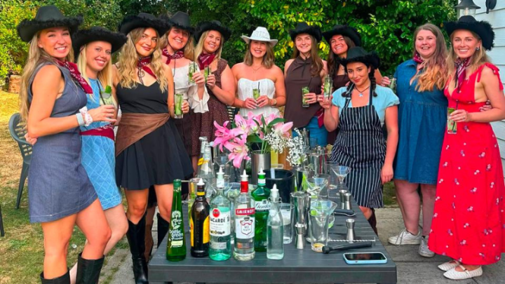 Group of friends enjoying a cocktail-making session at Blackfirs Farmhouse